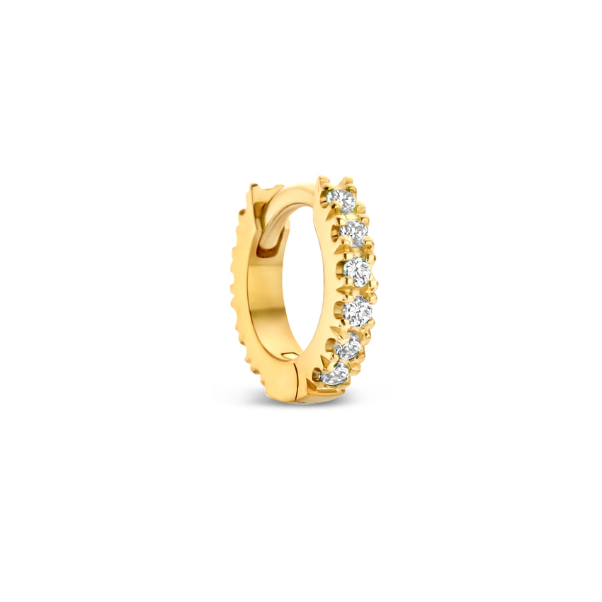Gold hoop earring with embedded diamonds.