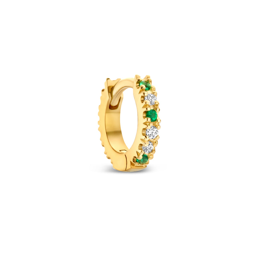 Gold hoop earring with green emeralds and white diamonds.