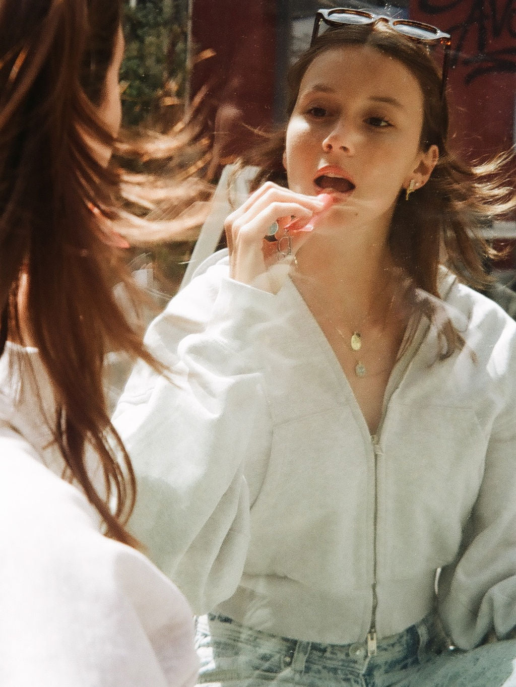 Lavender earrings worn on model.
