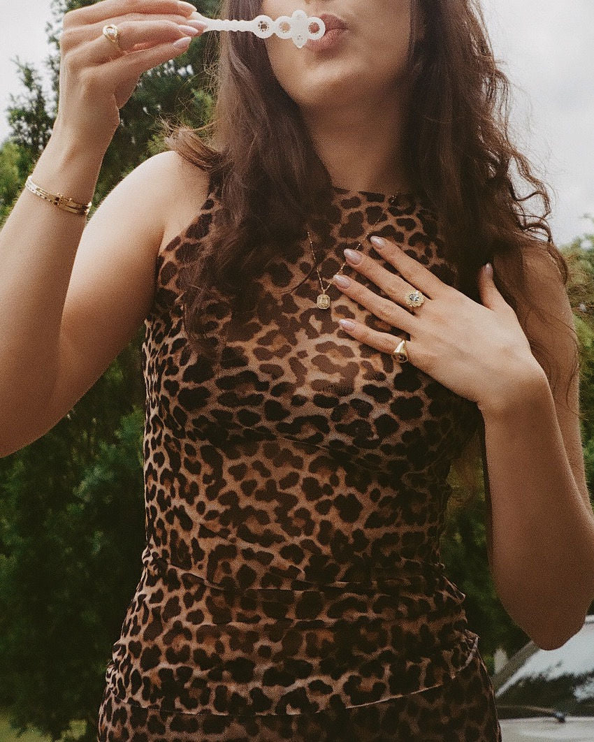 Rosalie Charm blue on a chain, model is also wearing our CC006 in Blue.