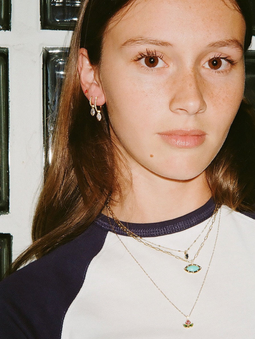 Ruby ear stud paired with two hoops (S & L) and drop charms.