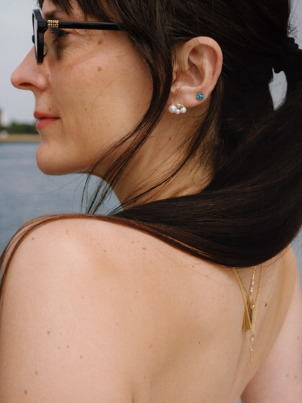 Close-up of a woman's ear with earrings.