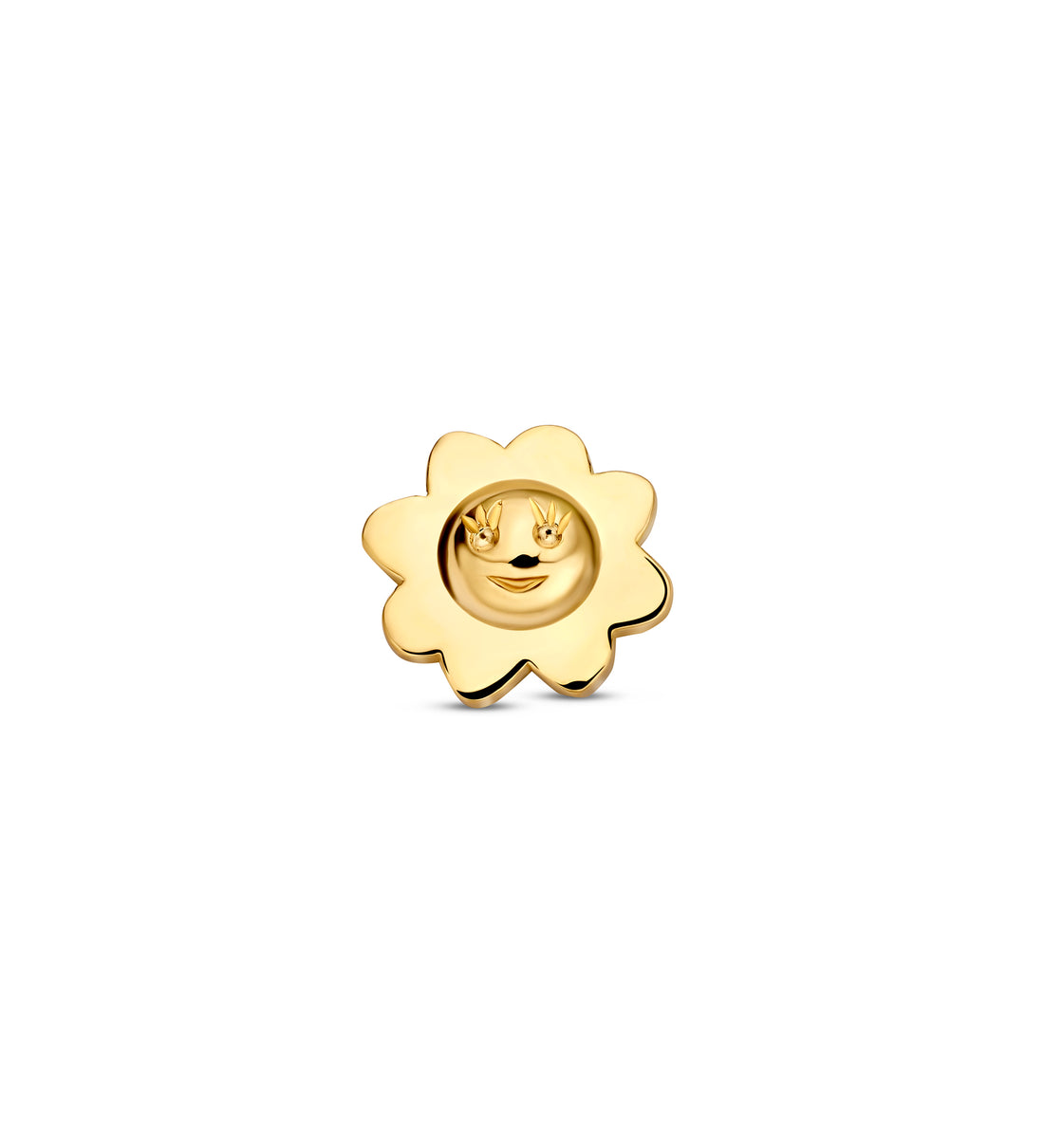 Gold sun-shaped charm on a white background