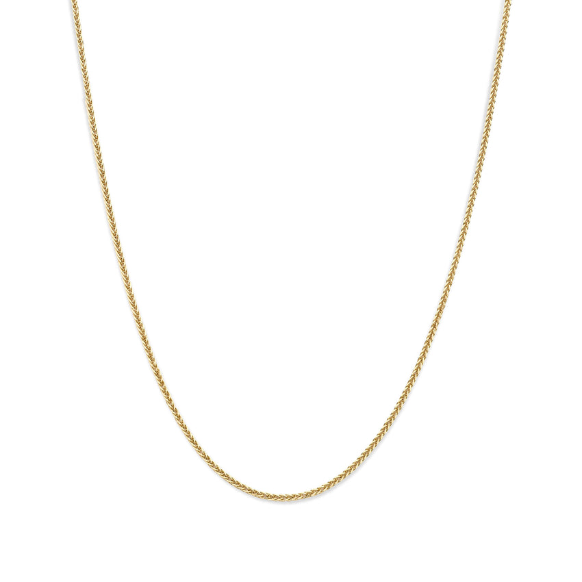 Gold chain necklace on a white background